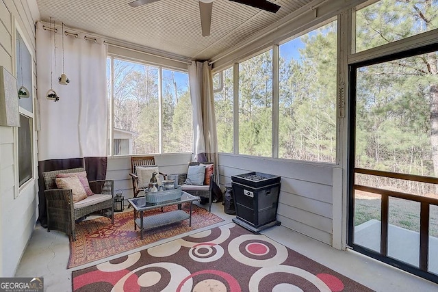 sunroom with a ceiling fan