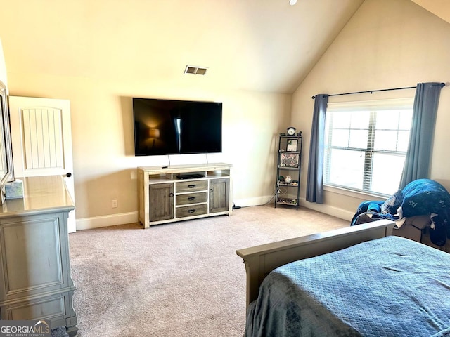 bedroom with vaulted ceiling, carpet floors, visible vents, and baseboards