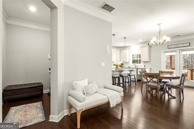 dining area featuring ornamental molding, dark wood finished floors, visible vents, and baseboards