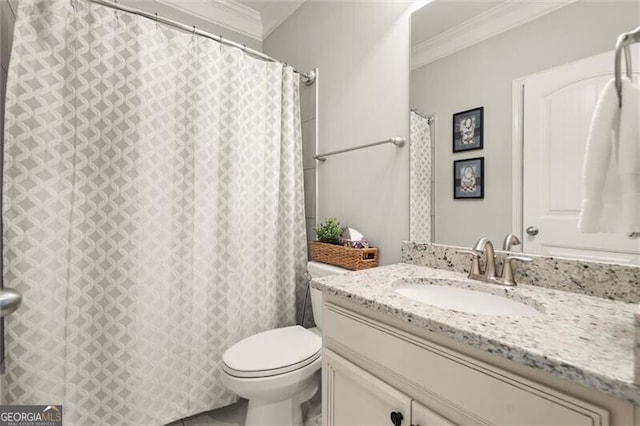 bathroom with toilet, crown molding, and vanity