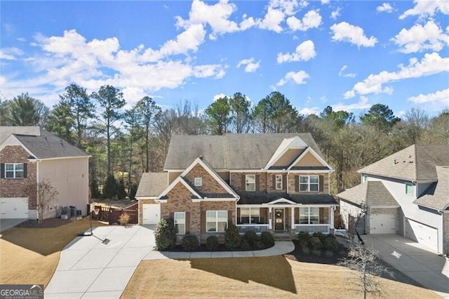 view of front of property featuring concrete driveway and brick siding