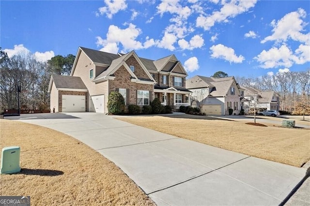 view of front facade with brick siding, concrete driveway, a garage, a residential view, and a front lawn