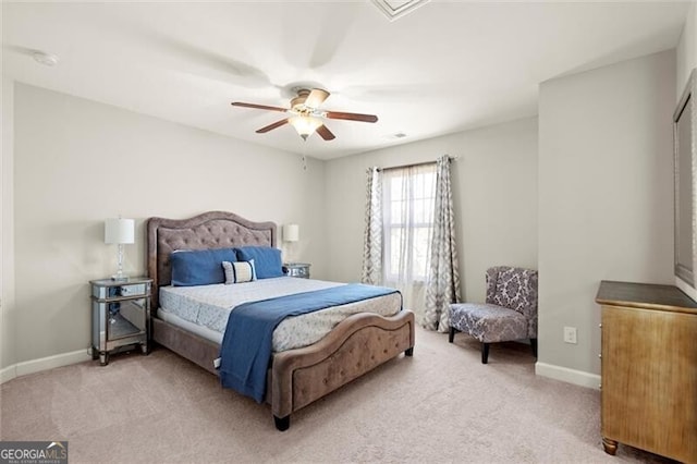 bedroom with carpet, baseboards, and a ceiling fan