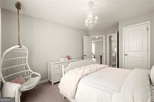 bedroom featuring light carpet, a closet, baseboards, and an inviting chandelier