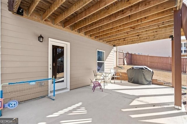 view of patio with fence and grilling area