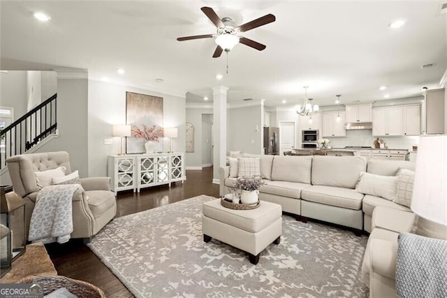 living room with stairs, ornamental molding, dark wood finished floors, and recessed lighting