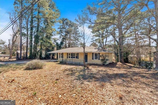 ranch-style home with covered porch