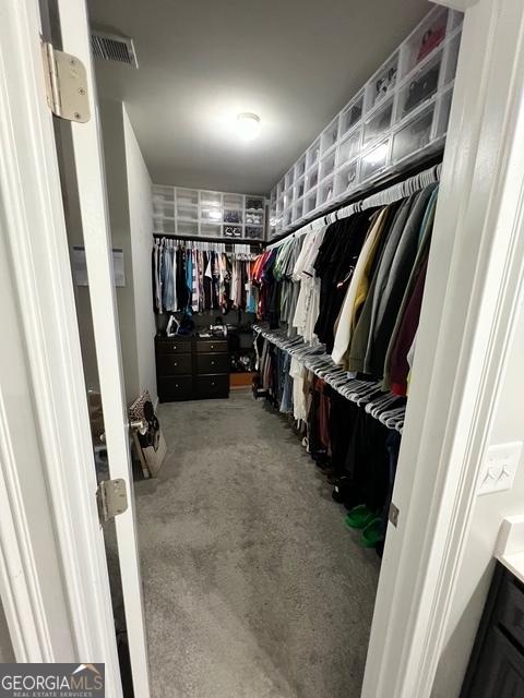 walk in closet with visible vents