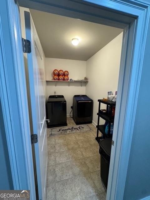 washroom with laundry area and washing machine and dryer