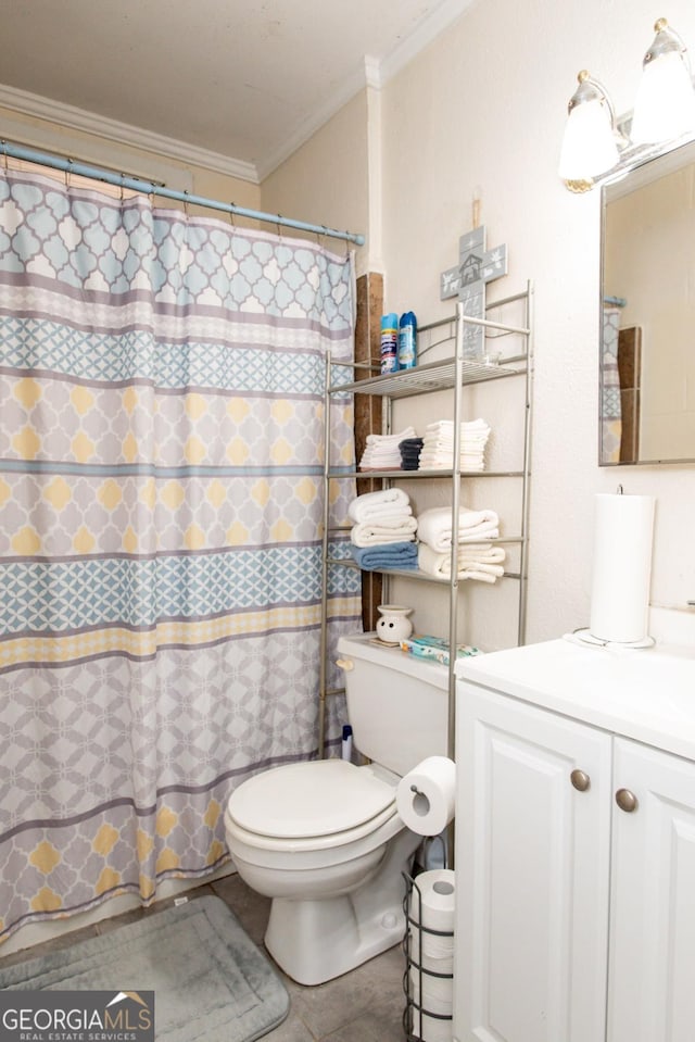 bathroom featuring a shower with shower curtain, toilet, ornamental molding, tile patterned floors, and vanity