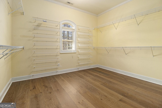 spacious closet with wood finished floors and visible vents