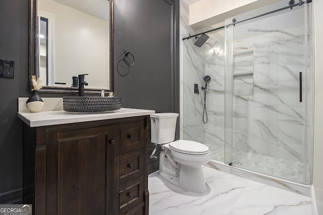 full bathroom featuring a marble finish shower, marble finish floor, vanity, and toilet