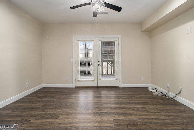 empty room featuring french doors, wood finished floors, visible vents, and baseboards