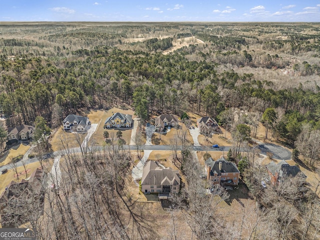 bird's eye view featuring a forest view