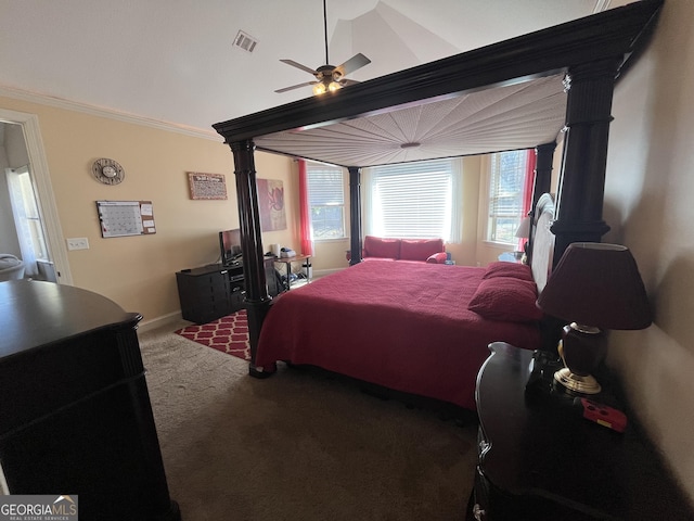 carpeted bedroom with baseboards, ornamental molding, visible vents, and a ceiling fan