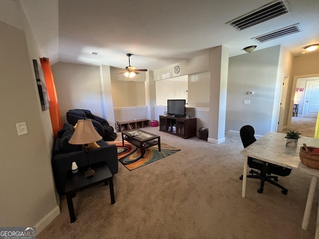 living area with lofted ceiling, baseboards, visible vents, and carpet flooring