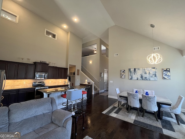 kitchen featuring visible vents, appliances with stainless steel finishes, and open floor plan