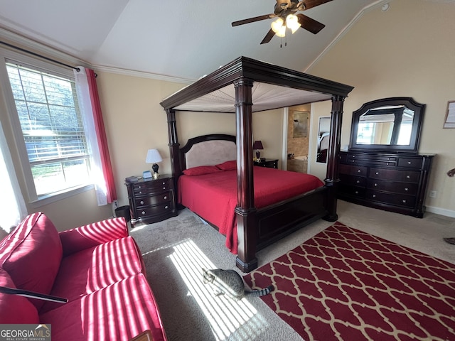 carpeted bedroom featuring ornamental molding, vaulted ceiling, and a ceiling fan