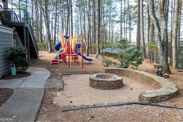 community jungle gym with a fire pit