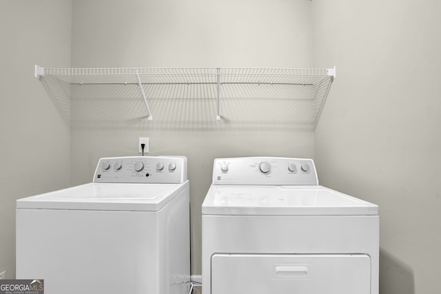 washroom with washer and dryer and laundry area