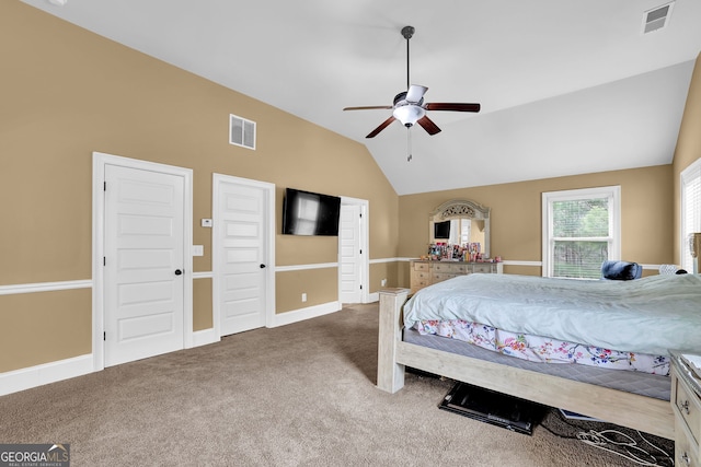 bedroom with baseboards, visible vents, vaulted ceiling, and carpet flooring