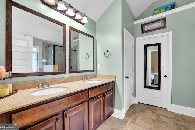 full bath with lofted ceiling, a shower with door, double vanity, and a sink