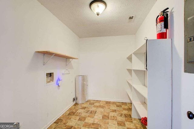 washroom with laundry area, baseboards, visible vents, hookup for a washing machine, and a textured ceiling