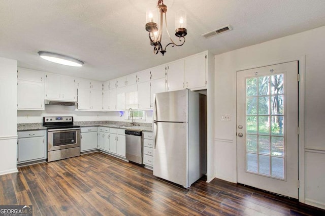 170 Roberts Rd, Covington, GA 30016 - kitchen with stainless steel appliances, dark wood-style flooring, a chandelier, white cabinetry, and a textured ceiling