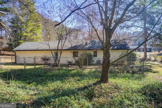 exterior space with central AC unit and fence