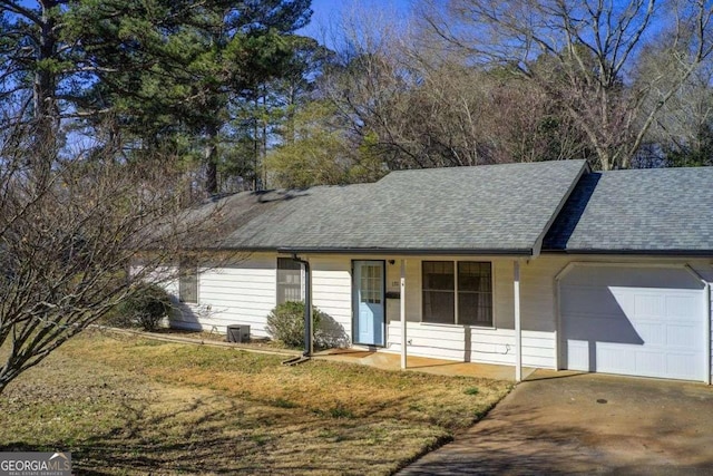 170 Roberts Rd, Covington, GA 30016 - ranch-style house with a garage, a shingled roof, covered porch, and driveway