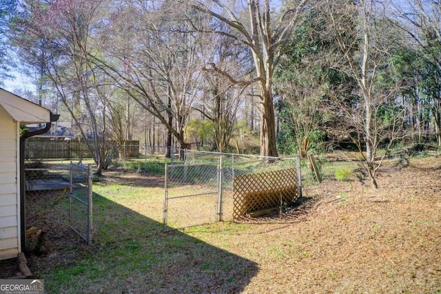 view of yard with a gate and fence