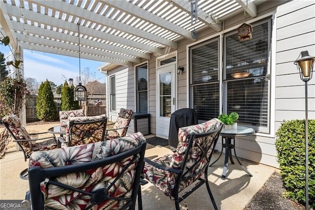 view of patio with outdoor lounge area, fence, area for grilling, and a pergola