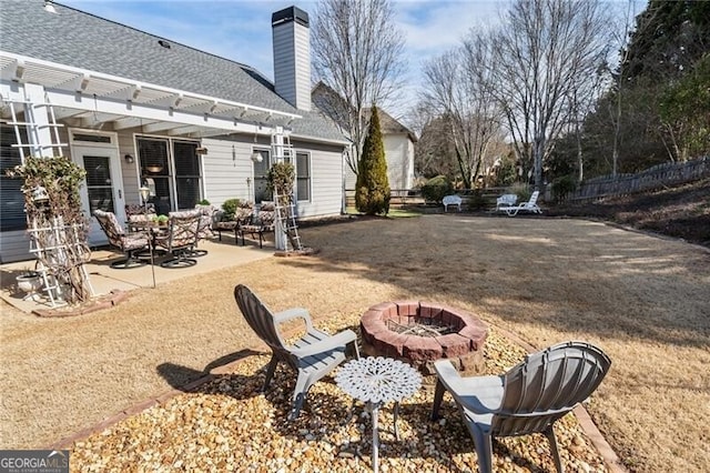 view of yard featuring a patio area, an outdoor fire pit, and a pergola