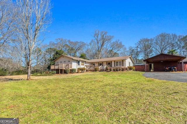 ranch-style home with a front lawn