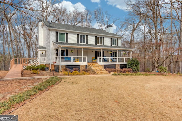 view of front facade featuring covered porch, a shingled roof, a chimney, and a front lawn