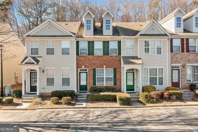 view of property with brick siding