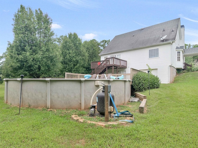 view of yard with an outdoor pool and a wooden deck