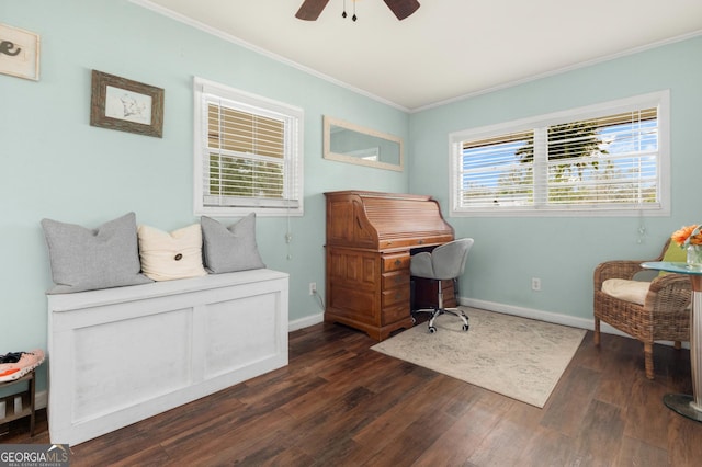 office space with ornamental molding, dark wood finished floors, baseboards, and a ceiling fan