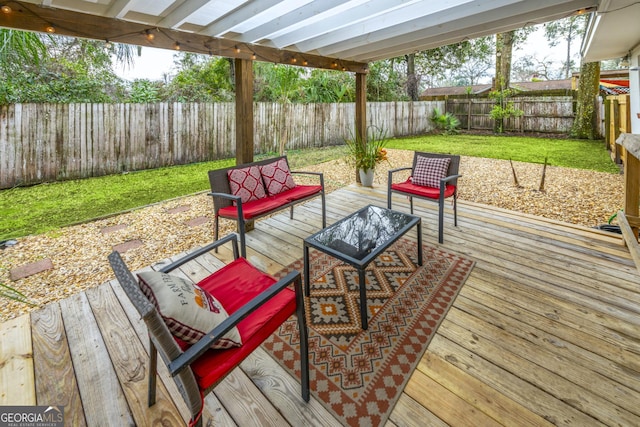 wooden terrace with an outdoor hangout area, a yard, and a fenced backyard