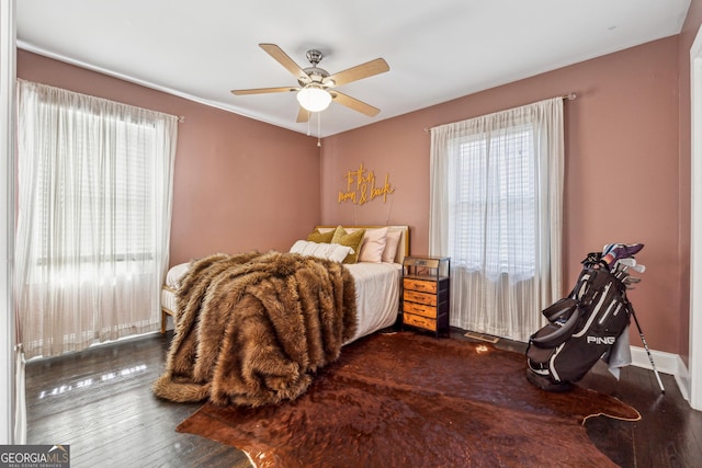 bedroom featuring ceiling fan and wood finished floors