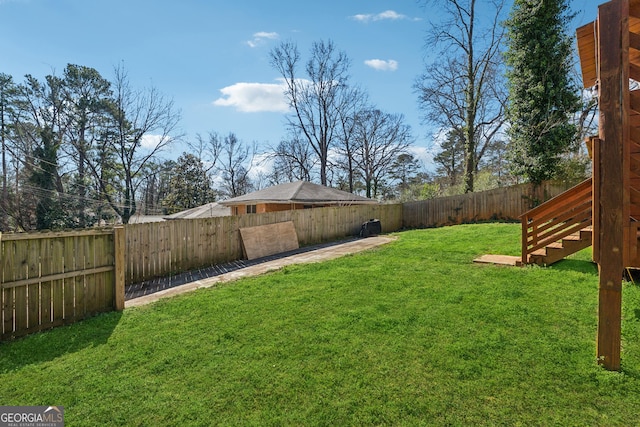 view of yard with a fenced backyard