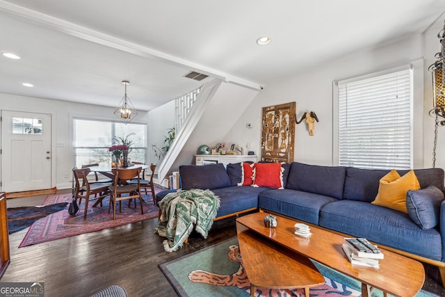 living room with visible vents, wood finished floors, stairs, a notable chandelier, and recessed lighting