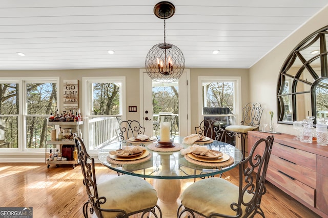 dining area with an inviting chandelier, recessed lighting, and light wood-type flooring