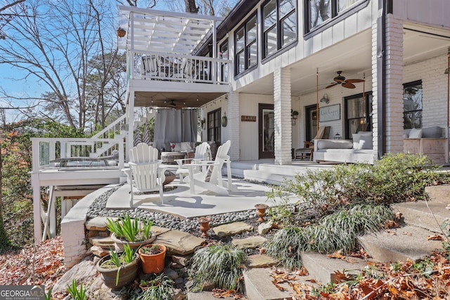 rear view of house with ceiling fan