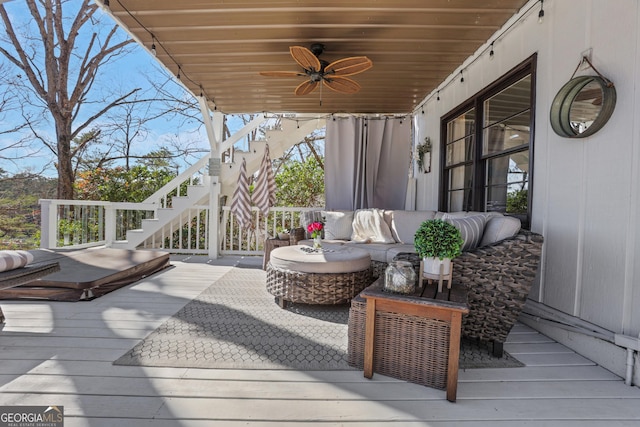 deck with ceiling fan and outdoor lounge area