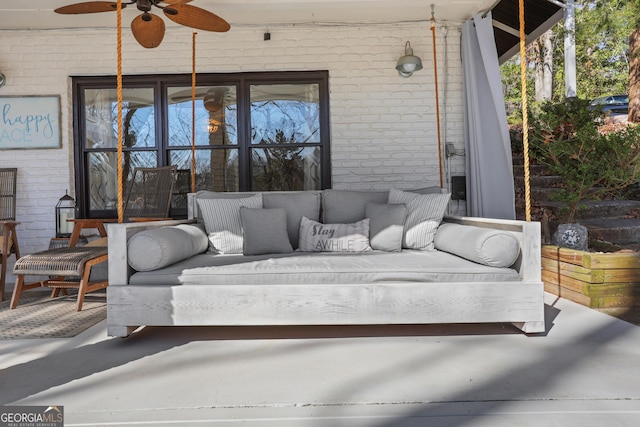 view of patio with outdoor lounge area and a ceiling fan