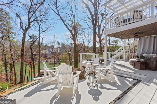 view of patio / terrace with a wooden deck and ceiling fan