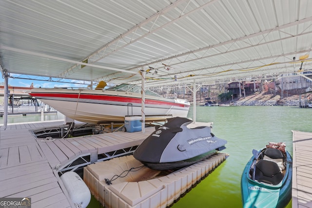 dock area featuring boat lift and a water view