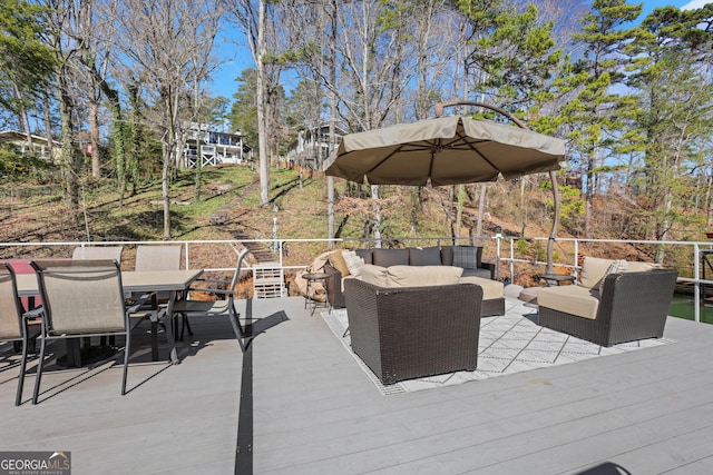 view of patio featuring an outdoor living space, outdoor dining area, and a deck