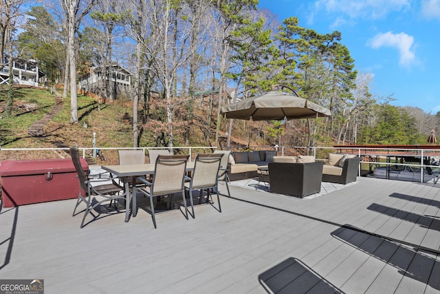 wooden deck with outdoor dining space and an outdoor living space